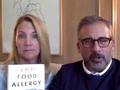 Both Steve Carell and Nancy Carell are speaking to the camera as Nancy is holding the book in her hand.